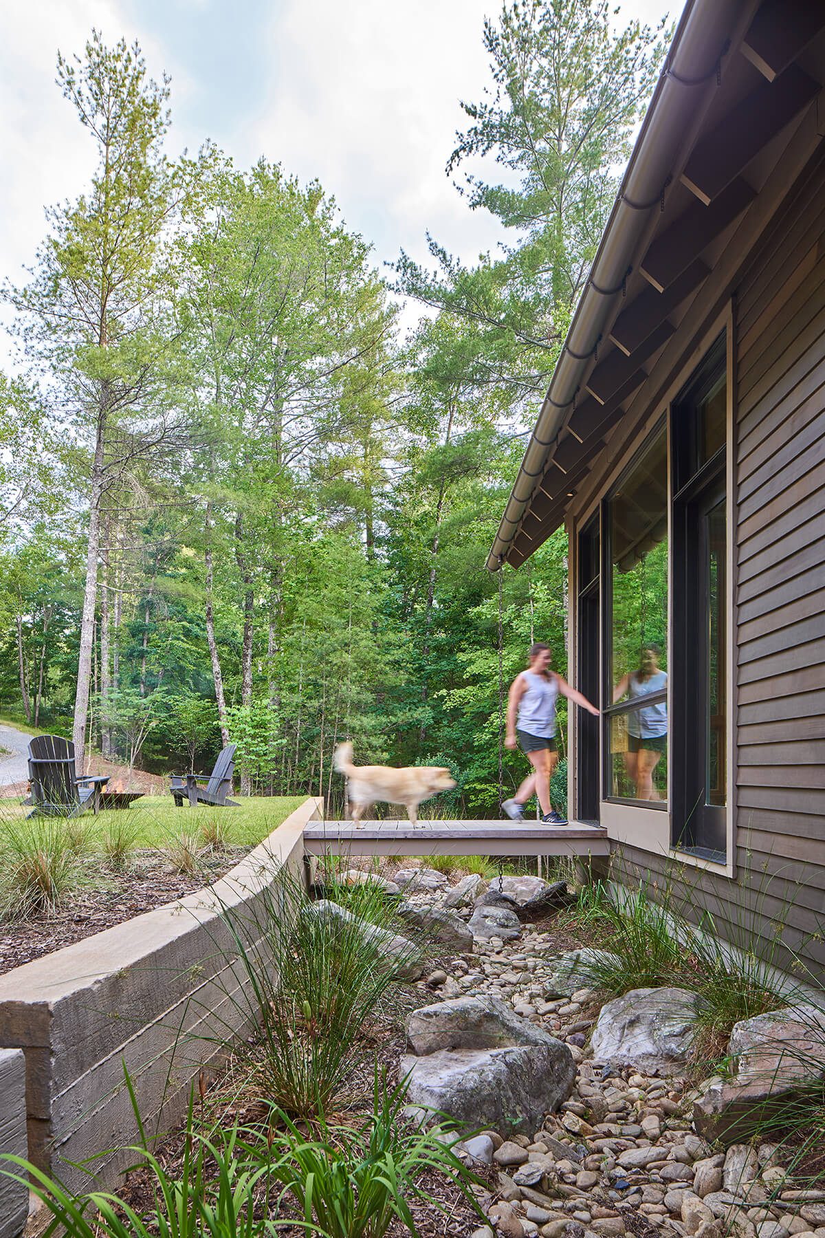 The Camp Campos lawn and bridge architectural home design in Western North Carolina