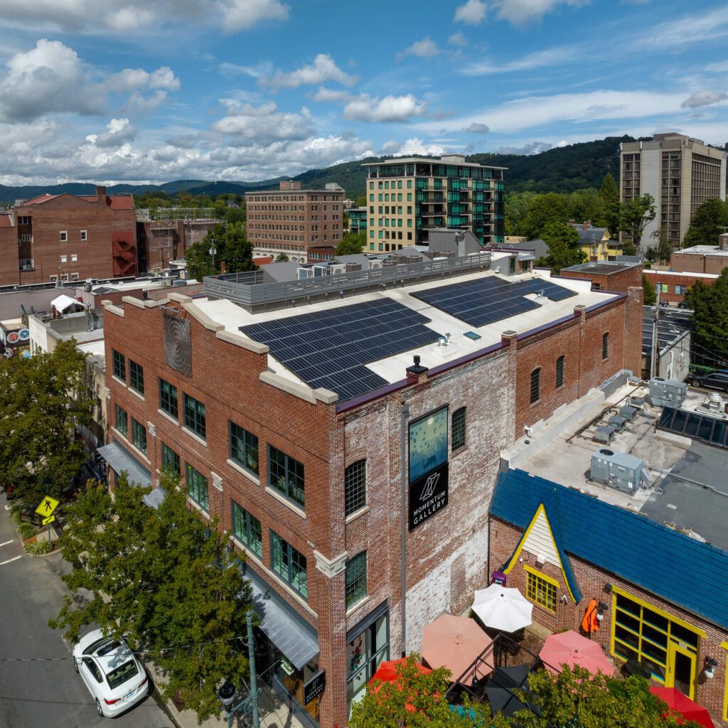 52 Broadway Historic Renovation Solar Panels against Asheville skyline